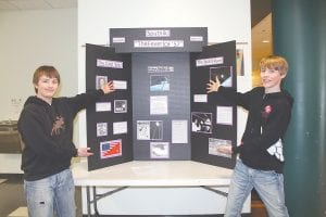 Cook County Middle School students in Dorie Carlson and David Liechty’s eighth-grade classes have immersed themselves in history this winter, writing thesis papers and preparing displays for History Day presentations. At the beginning of March, students set up their displays in the Arrowhead Center for the Arts. Left: Jack Viren and Will Lamb introduce visitors to their display Sputnik: The Fever of ’57.