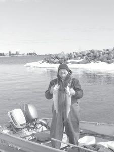 Steve and Eric Ford have to be some of the first fishermen out on Lake Superior in 2013. They launched their 14-foot boat and fished just outside the Grand Marais harbor on Wednesday, March 27. Steve shows off the nice 3-pound lake trout they caught. A great spring dinner!