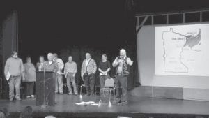 The art of storytelling is alive and well in Cook County. On March 9, 2013, the Arrowhead Center for the Arts was packed with people eager to hear these speakers: (L-R) Victor Aubid, Alta McQuatters, Sue Kerfoot, J. Milt Powell, Chet Lindskog, Tim Cochrane, Gene Erickson, Carrie McHugh, and Billy Blackwell.