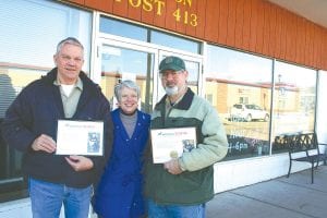 Members and friends of the First Congregational Church United Church of Christ and American Legion Post 413 worked together to raise funds for America’s VetDogs, which provides a specially trained service dog to a disabled veteran—at no charge to the veteran. Pastor EvaLyn Carlson of First Congregational, who got the project rolling, presents certificates to American Legion Post 413 Commander Don Wilson (left) and Steve Deschene (right) of the First Congregational Outreach Committee. The certificates include a photo of the Minnesota veteran who receives assistance from a VetDog.