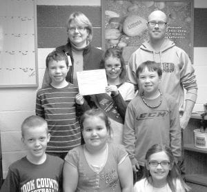 The Cook County School District is pleased to announce that it is the recipient of $1,000 from the Exxon Mobil Corporation Educational Alliance grant program. This donation was made possible because of the support of Paul Goettl, owner of Clearview General Store in Lutsen, and Wade LeBlanc, owner of North Shore Oil & Propane in Silver Bay. Each business donated $500 and the funding will go towards math or science education in Sawtooth Mountain Elementary School and Cook County High School. Paul Goettl presents his check to Principal Gwen Carman, along with several appreciative third graders! (L-R) Jacob Dorr, Sienna Deneweth, Anna Hay. (L-R, middle) Isaac Cuevas, Riley Goettl, and Tucker Bakko. (L-R, back) Carman and Goettl.