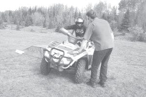 Volunteer ATV Safety Instructor Steve Lashinski supervises a student as he maneuvers an ATV on a simulated side hill during last year’s ATV safety course. Registration is open now at Cook County Community Education for this year’s class.