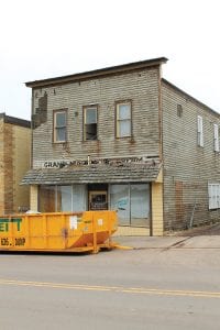 In preparation for the demolition of the old building behind Joynes Ben Franklin on First Avenue, the siding has been removed, revealing traces of a sign from the building’s former life as Grand Marais Ice Cream. The building most recently was used as storage for Joynes Ben Franklin, but has deteriorated to the point that it needs to come down. See more on page A9.