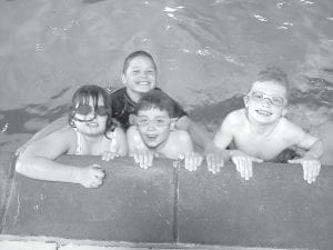 Above: Spending time at the Grand Marais Municipal Pool is just one of the many activities offered at “Out Of School Adventures.” Left: Youth Programs Coordinator Melissa Wickwire oversees the fun.