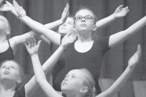 Community members were treated to three performances of dance at the Betsy Bowen Studio on April 19-21 as Lenna’s Dance Program presented A Spring Recital. Dancers ranging in age from kindergarten to adult took to the stage to share their love of dance. Above: These young dancers performed Into the Flames to Adele’s Set Fire to the Rain. Right: Dance teacher and choreographer for most of the recital, Lenna Stever- Sobanja, applauds her students at the conclusion of the show.