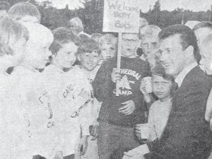 Minnesota Twins’ star Bob Allison had fans galore when he visited the Cathedral of the Pines on Caribou Lake in July 1965. Bob and his wife Betty were guests of the camp when they came to see their son Mark, 9, and nephew, Douglas, 9, who were among the 124 campers there for a week. The picture shows Jeff Mendenhall holding a “Welcome Betty and Bob” sign as other children stand by. The Allisons were met by a decorated tractor and driven between two lines of cheering campers holding welcome signs; the children then fell in behind the tractor to form a parade to the main camp. Bob, who was kept busy signing autographs, had recently been hit by a pitch on his right wrist; the bandage can be seen in the photo.