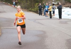 Sprinting hard for the finish line, Cook County High School senior Sarissa Falk won the women’s division of the Ham Run 5K in 21:30.