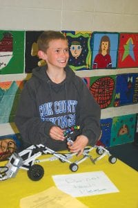 John VanderHeiden was all smiles as he displayed an interesting all-terrain vehicle he designed and built.