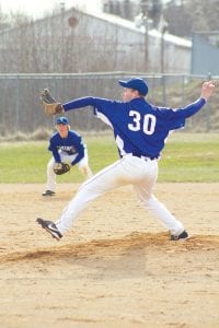 With shortstop Thomas Anderson ready to make a play, Colin Everson goes into his big wind-up in a game played against the Carlton Bulldogs earlier this season.