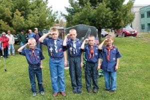 Joining the many community members at the Monday, May 27, 2013 Memorial Day ceremony on the Cook County courthouse lawn were these local Cub Scouts (L-R) Preston Benedix, Caleb Benedix, Jonah Schmidt, Brayden Schmidt, and Ethan Tate. The young scouts gave a respectful salute to veterans.