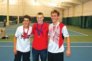 Sophomore Lars Scannell (middle) was all smiles after he won the Section 7A Individual Tennis Tournament held in Virginia on May 21. Scannell will play in the state tennis tournament on June 6-7. Lars is the first Viking boy to win the Section 7A singles crown from Cook County.