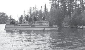 Above: Camp Menogyn shuttled guests across the lake by pontoon boat. Left: Guests enjoyed the hearty breakfast in the beautiful YMCA Camp Menogyn dining room. Program Director Mayo said, “This is a great opportunity for folks to get to see us and it’s a nice way for us to reach out to the community.”