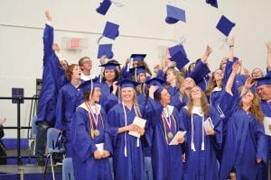 The Cook County High School Class of 2013 celebrates the end of commencement exercises—and their high school career—with a toss of the mortarboard. The June 1 ceremony was joyful from beginning to end.