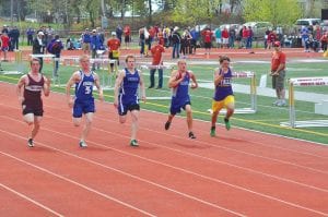 Showing the sprint form that is taking him to state in both the 100 meter and 400 meter runs, Peter Warren powers down the track to finish 3rd in the Section 7A finals in the 100 meters. Normally only the top two finishers advance to state, but Peter broke the state standard qualifying time. Peter, a senior this year, is the son of Andrew and Susan Warren, Grand Marais.