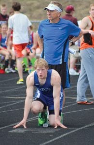 With Coach Chris Hegg standing on his blocks, Peter Warren got set to practice his start before the 100-meter race at the State Meet held Friday and Saturday, June 7 and 8 at Hamline. Warren also qualified in the 400 meter run and ran under 51 seconds but failed to advance to the finals in either the 100- or 400-meter runs although he ran extremely well, earning lifetime bests.