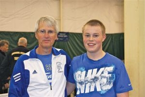 Sophomore Lars Scannell posted the best finish ever for a Cook County High School boy at the state tennis tournament by defeating Ty Misialek of East Grand Forks to win the consolation championship. He is pictured here with Coach John Muus.