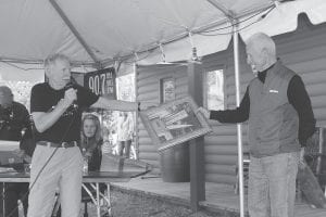 The WTIP Community Radio annual meeting on Friday, June 7, included recognition of WTIP volunteers. Buck Benson, co-host of WTIP’s Roadhouse presented a special Roadhouse print to his retiring co-host Bob Carter.