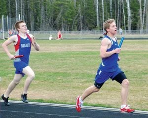 Left: Ben Seaton was a workhorse for the Vikings this season. He typically ran the mile and ran several legs in relays. Seaton, a senior, will be missed next year. Above: Showing great form, Rachel Todd (right) placed third in the 100-meter hurdles at the Polar League conference meet. Like Seaton, Todd was a senior and will be missed next year.