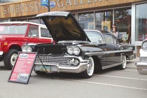 Above: Jerry Loh’s 1958 Chevy Impala won first place in the Class B, cars from 1951- 1964 division at the 2013 Annual Classic Car Show held in downtown Grand Marais on Saturday, June 15. Left: Mike Pratt (left) and Pat Eliasen kept the car enthusiasts entertained with music played by their band, Oversized Load.