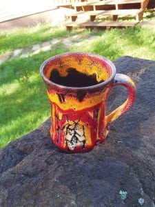 The Grand Marais Art Colony offers a number of free activities this summer, including the opportunity to learn about pottery with Joan Farnam, who creates lovely pieces like this fiery-toned mug.