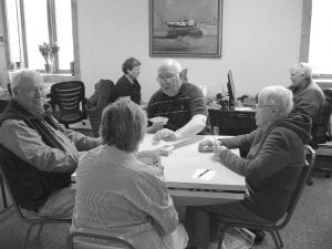 Card playing at the Senior Center, every afternoon—everyone is welcome! (L-R, clockwise) Fred Schmidt, Tom Hedstrom, Gladys Anderson and the back of Kaye Kraft’s head.