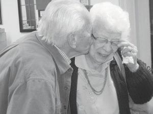 There is always something to laugh about at the Cook County Senior Center. Warren Anderson gives Lu Pettijohn a pre-birthday kiss. You see it is not so bad to be almost 100 years old!