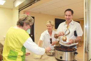 Lutsen Supervisor Ginny Storlie helped serve the savory chili. Tom and Ann Rider enjoyed dinner with other Lutsen residents and Lutsen’s emergency personnel.