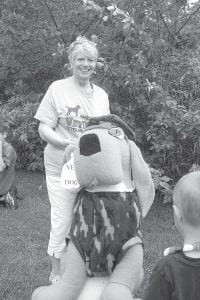 Reverend EvaLyn Carlson with the “Vet Dog” that has helped draw attention to the cause of raising money for America’s VetDogs. The First Congregational Church and American Legion Post 413 have worked together to raise money to support the VetDog program.