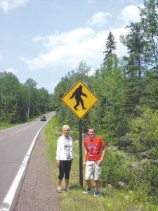 Marilyn Carlson and her grandson, Asher Floyd, do not know who erected the “Bigfoot Crossing” signs on the Gunflint Trail, but they were among the folks who found the prank funny. Many others however, were not amused and the signs have been removed.