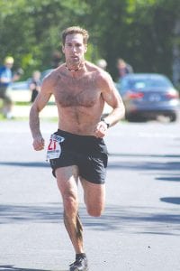 First to cross the finish line, Adam Swank of Duluth, ran away from the field for the second year in a row.