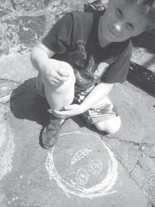 Whether they are in Honduras or Hovland, kids—like Daniel Bockovich, above—love to express themselves with chalk. And sidewalks or not, they find a way.