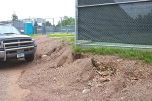 Construction of the parking lot at the new Cook County Community YMCA has disturbed the area around the north tennis courts, causing some erosion and accessibility issues. At the July 16 county commissioners' meeting, commissioners voted to seek bids to restore the walkway and deal with the erosion. They also agreed to add a water fountain that has already been purchased and some additional steps. ORB Management Project Manager Wade Cole said he estimated that the work would cost $20,000 - $25,000, but commissioners said they hoped it would be much less.