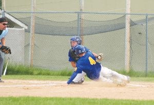 Top: When he’s not pitching or playing shortstop, Colin Everson gets the job of catching. Here he absorbs a hard slide to tag out the runner trying to score. Everson also has the second-best batting average for the team at .500.