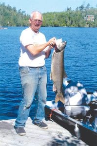 Left: It was a good day on the lake for Donn Boostrom of Arizona and Grand Marais, who caught this 19-pound 10-ounce lake trout on Clearwater Lake on the 4th of July.