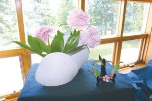 This arrangement of peonies at the West End Garden Club show, called “Rhapsody in Blue,” (left) was made by Mary Lou Huron. These thistles (right) are beautiful albeit prickly. According to Carol Spencer, who arranged them, they are the official flower of Scotland and helped the Scots defeat the Brits on the battlefield.