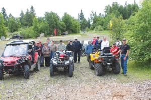 The Cook County ATV Club gathered for its annual Tom Lake Shoot & Ride on Saturday, July 20. Above: Some of the group posed for a photo at the Tom Lake heliport/gravel pit before target practice began. There were riders from Lutsen, Tofte, Hovland and Grand Marais, as well as some visitors from Illinois and Iowa. With all of the different firearms to try, shooting took several hours. After shooting, club members enjoyed riding on the scenic Tom Lake area trails.