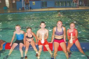 Eight members of the North Shore Rollers logrolling team competed at the Namekagon River Roll-Off on Sunday, July 21 in Hayward, Wisconsin. Dominic Wilson won first place in the U10 boys' division while Paige Everson placed third in the U10 girls' division. Jessica Berg-Collman finished 6th out of 22 women in the Boom Run in the professional division. (L-R) Robin Henrickson, Taylor Everson, Dominic Wilson, Reilly Wahlers and Paige Everson.