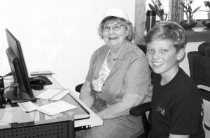 The Cook County Senior Center is a fun place for young and old. Above left: The Senior Center celebrated Lu Pettijohn’s 100th birthday. Above: The center offers individual computer training with help from kids taking part in Cook County’s Incredible Exchange students. Bev Denyes and Incredible Exchange student Lynden Blomberg do some computer work. Left: Sherrie Lindskog was all smiles at the birthday celebration at the senior center in honor of her 70th birthday.