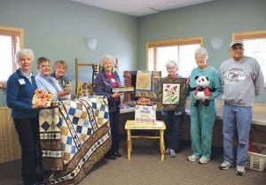 Organizers of the MidTrail Auction and Boutique show off some of the wonderful items donated to the fundraiser for bidding and buying. (L-R) Voni Swanson, Carol Stockman, Joan Perusse, Lee Zopff, Ina Huggenvik, Keitha Herron, Leroy Ullrich.