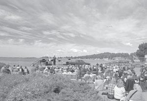 A blue sky dotted with fluffy white clouds overlooking the harbor created a spectacular setting for a worship service held by Cornerstone Community Church of Grand Marais on Sunday, August 4, 2013, the last day of Fisherman’s Picnic.