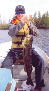 Left: Michael Sueppel, 15, caught this 33-inch walleye on July 9. He was visiting his grandparents, Bill and Pat Sueppel, at their home on Seagull Lake.