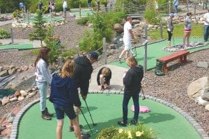 With the putt on the way, all this golfer could do was hope and hope and hope as the ball raced for the hole. He and his partners were among the 40 adults and nearly 20 children to play in the mini golf tournament held August 4 at the Putts N’ Pets mini golf course. Oh, by the way, the ball slid into the cup and a quick celebration ensued before the foursome headed to the next hole.