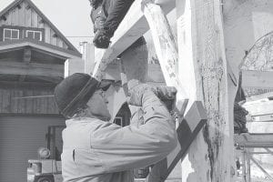 Peter Henrikson of North House Folk School oversaw the construction of the grindbygg that will be dedicated at the North Shore Commercial Fishing Museum on Saturday, August 24. A grindbygg is a Norwegian-style timber frame. It will cover and protect the historic Viking fishing boat.