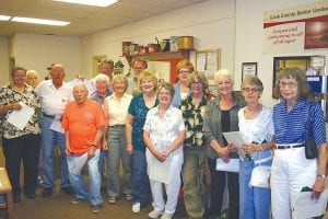 When you shop at the First & Second Thrift Store all of the proceeds are given to nonprofit organizations in Cook County. From January to June volunteers at the thrift store raised nearly $24,000 that was divvied up (above) to representatives of 35 organizations. Checks were distributed at a luncheon held at the Cook County Senior Center on August 15.