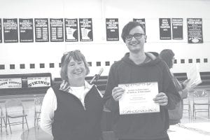 Sue Riley, who established the Daniel Patrick Riley Memorial Scholarship with help from the Cook County Community Fund, makes the 2011 scholarship presentation to Will Brandenberg.