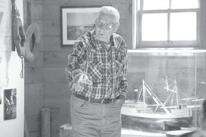 Upper left: Walter Sve shares some of the history of his fishing family and the Viking. Lower left: Peter Henrikson, who oversaw construction of the grindbygg, talked about the interesting building technique. Above: Ginny Storlie talked about how the Tofte Historical Society came into being.