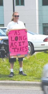 Ever since news broke that County Attorney Tim Scannell had a harassment restraining order issued against him by a Cook County family concerned about his relationship with their 17-year-old daughter, protestors have gathered at the courthouse on Fridays. From two to 10 people picket each week calling for Scannell’s resignation. Gary Nesgoda, pictured here with his protest sign, recently contacted Cook County Law Enforcement to report what he said was harassment by the county attorney.