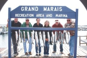 Above: The Fishin’ Chicks & Dad charter with Captain David Williams on August 18, 2013 was a success. The fishing party enjoyed “a really good day for catching salmon!” according to Dave’s wife, Cathi. (L-R) Lenny Stoppleman (Eagan), Dave Fish (Eagan), Denise Swenson (Aitkin), Sophie Rieland (Minnetrista), Danny Swenson (Aitkin), and Steve Rieland (Minnetrista).