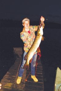 Left: Joe Rodgers of Minneapolis landed this big northern on a mid-Gunflint Trail lake on July 31 while fishing with buddy Coleman Cronstrom Maher in a canoe. Joe was staying at the cabin of Dick Cronstrom when he caught and released this 40- inch northern pike. He caught the monster while using a 4-inch fixed Rapala.