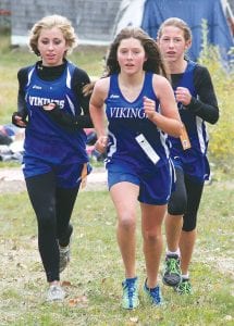 Left: Thee members of the girl’s cross country team, (L-R) Morgan Wyrens- Welch, Abigail Seipke and Maya McHugh are one year older and stronger then they were when this picture was taken last fall. Below: (L-R) Will Seaton, Sean McDonell, and Nate Carlson all look to be strong runners for the 2013 boys' varsity cross country team.